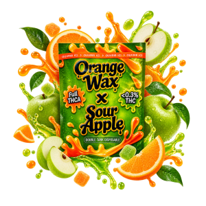 Packaging de vape THCA Double Tank Orange Wax x Sour Apple, entouré d’oranges, de pommes vertes, de feuilles et d’éclaboussures fruitées orange et vertes.